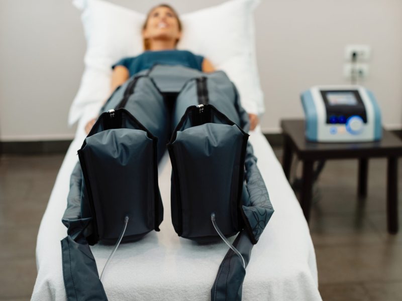 Close-up of pressotherapy treatment at spa center.